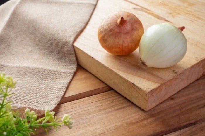Cleaning Barbecue with Onions