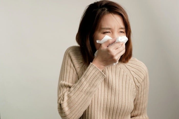 What is the reason for a runny nose after eating spicy foods?