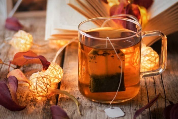 Drinking warm liquids to relieve mucus in the throat