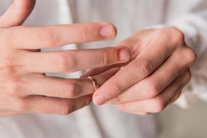 wedding ring, fidgeting with wedding ring Playing with a wedding ring